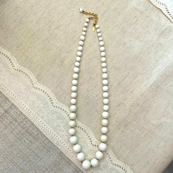 Monet Jewelry - Monet Necklace, graduated white beads and gold color spacers.